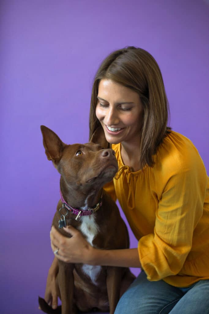 Christina Hunger hugs Stella the talking dog.